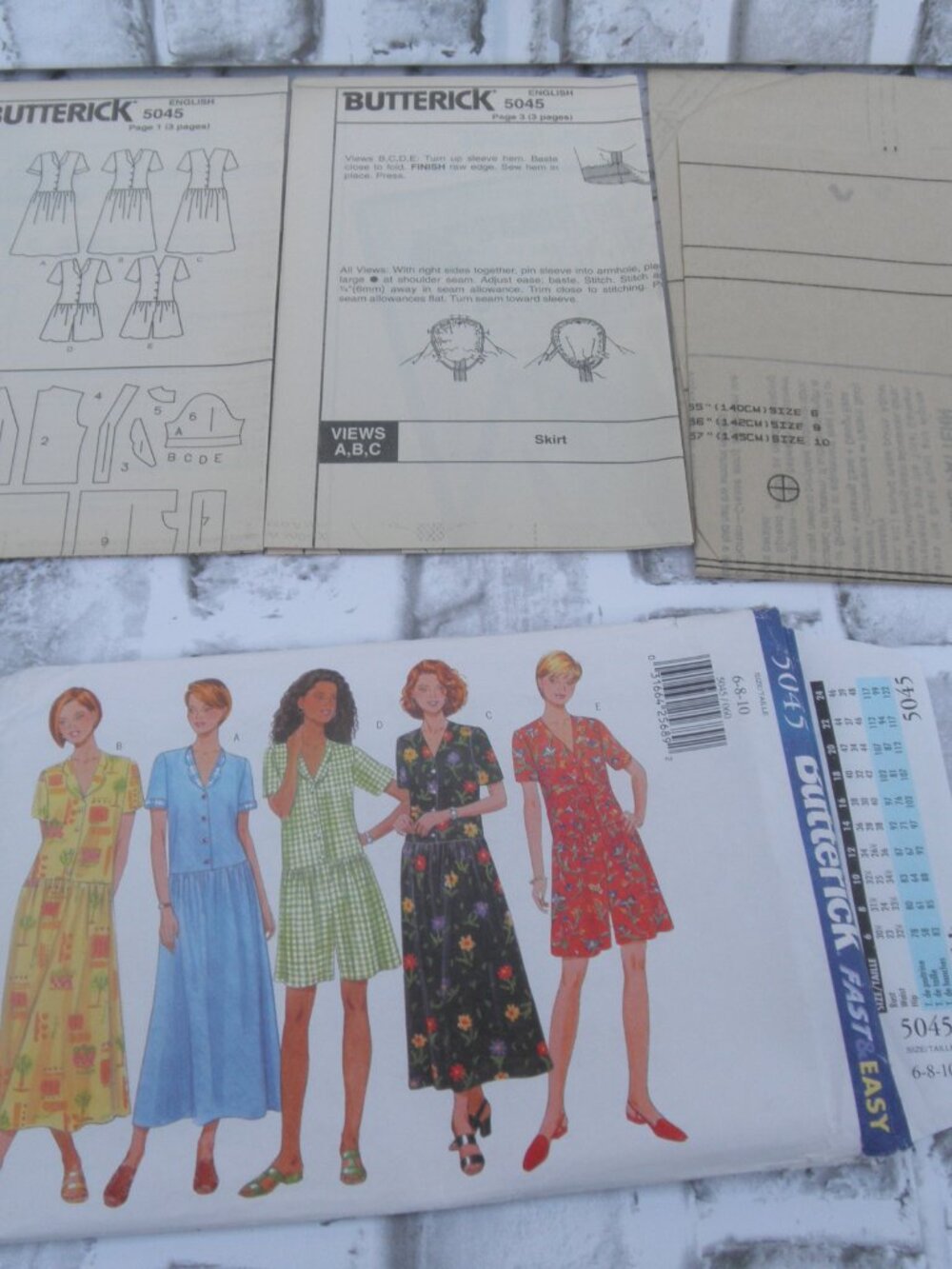 #5045 PRE-OWNED BUTTERICK UNCUT SEWING PATTERN DRESS AND JUMPSUIT SIZE 6-8-10